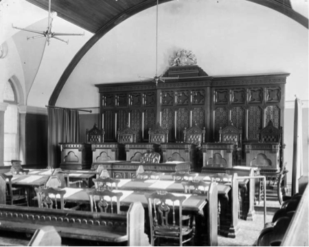 A black and white photograph of an old courtroom